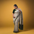 Maheswari fancy saree white color allover prints & zari border with short pallu and plain contrast blouse