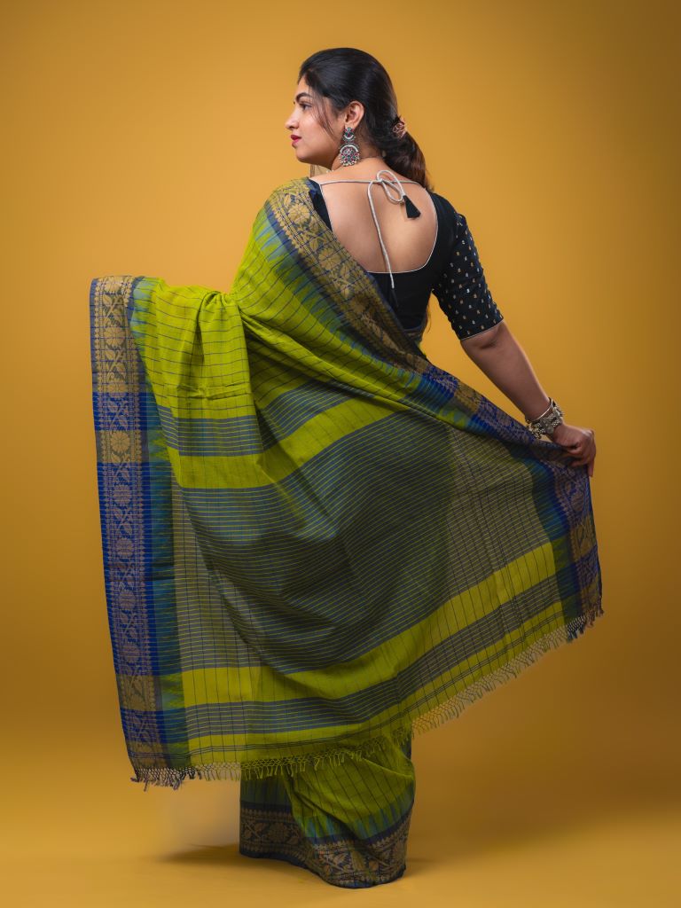 Jute kadhi cotton parrot green color allover checks & contrast border with contrast pallu and running blouse