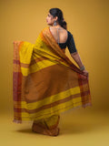 Jute kadhi cotton golden yellow color allover checks & contrast border with contrast pallu and running blouse