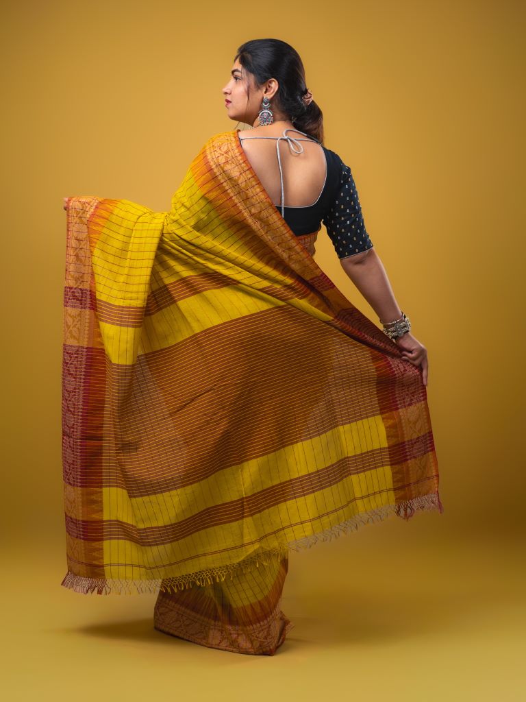 Jute kadhi cotton golden yellow color allover checks & contrast border with contrast pallu and running blouse