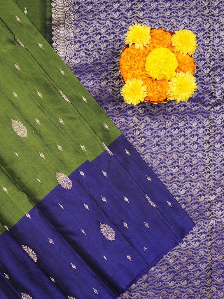 Kanchi pattu saree parrot green color allover zari motifs & zari border with rich pallu and contrast plain blouse