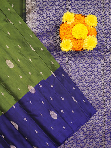 Kanchi pattu saree parrot green color allover zari motifs & zari border with rich pallu and contrast plain blouse