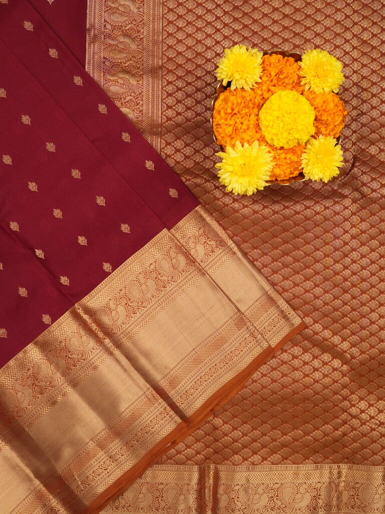 Kanchi pattu saree maroon color allover zari motifs & kanchi border with rich pallu and contrast plain blouse