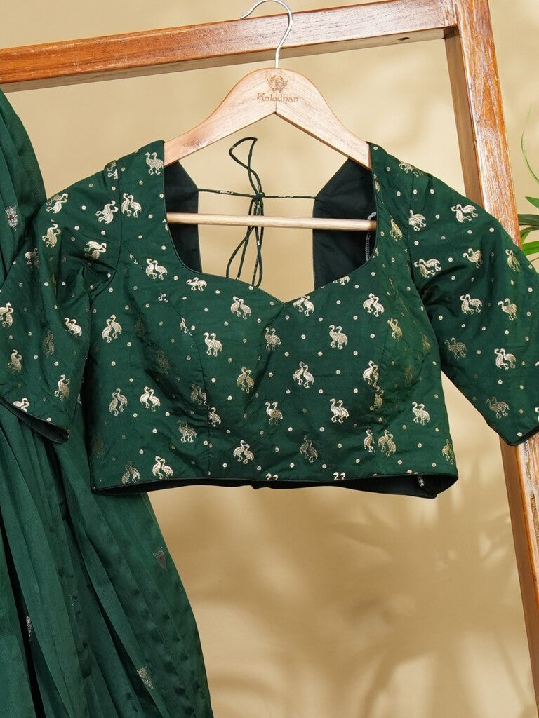 Raw mango lehenga set in dark green color with elegant weaving | Ready to wear