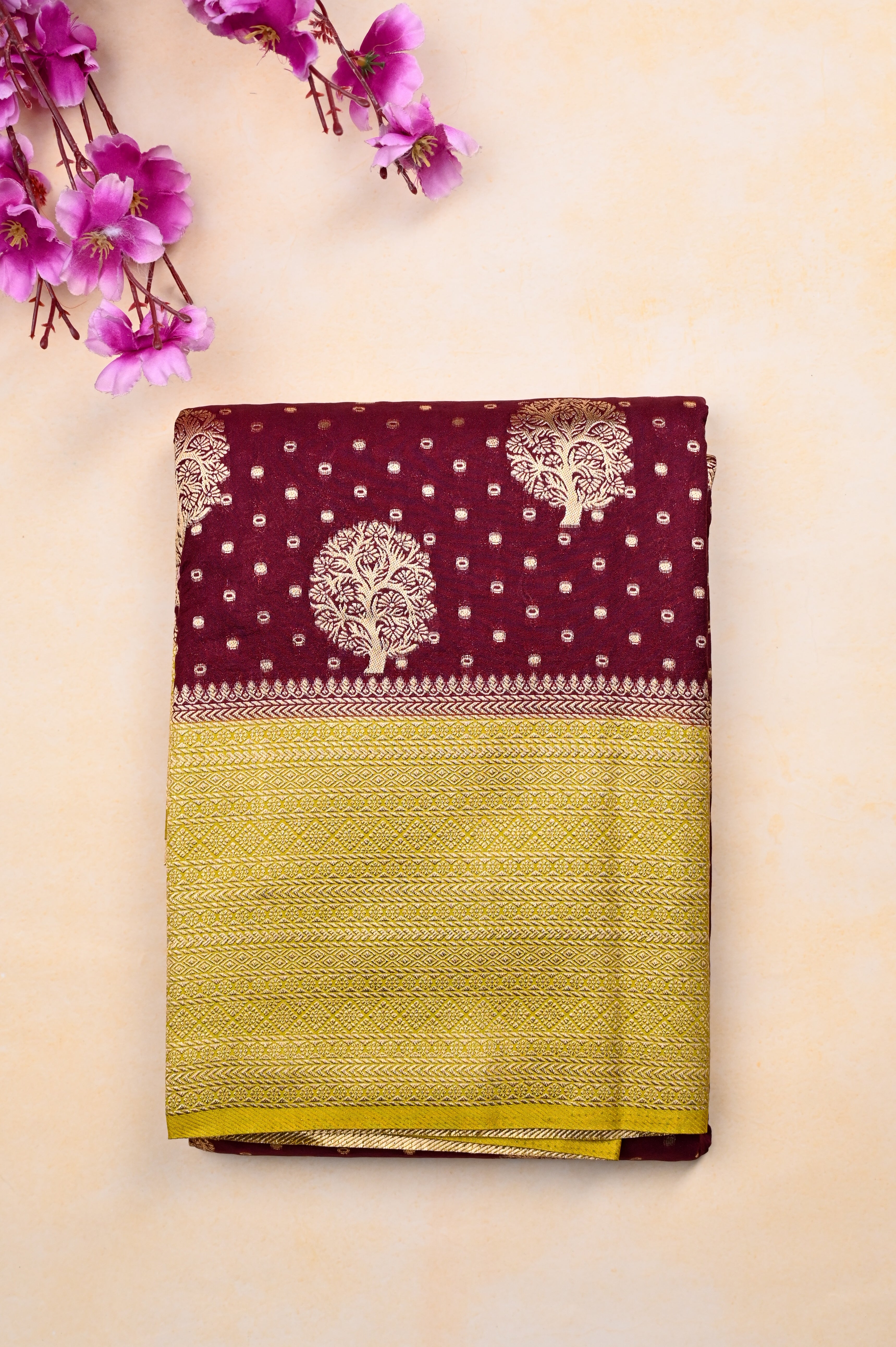 Banaras fancy saree maroon and yellow color with allover zari motive weaves, big zari border, pallu and plain blouse.