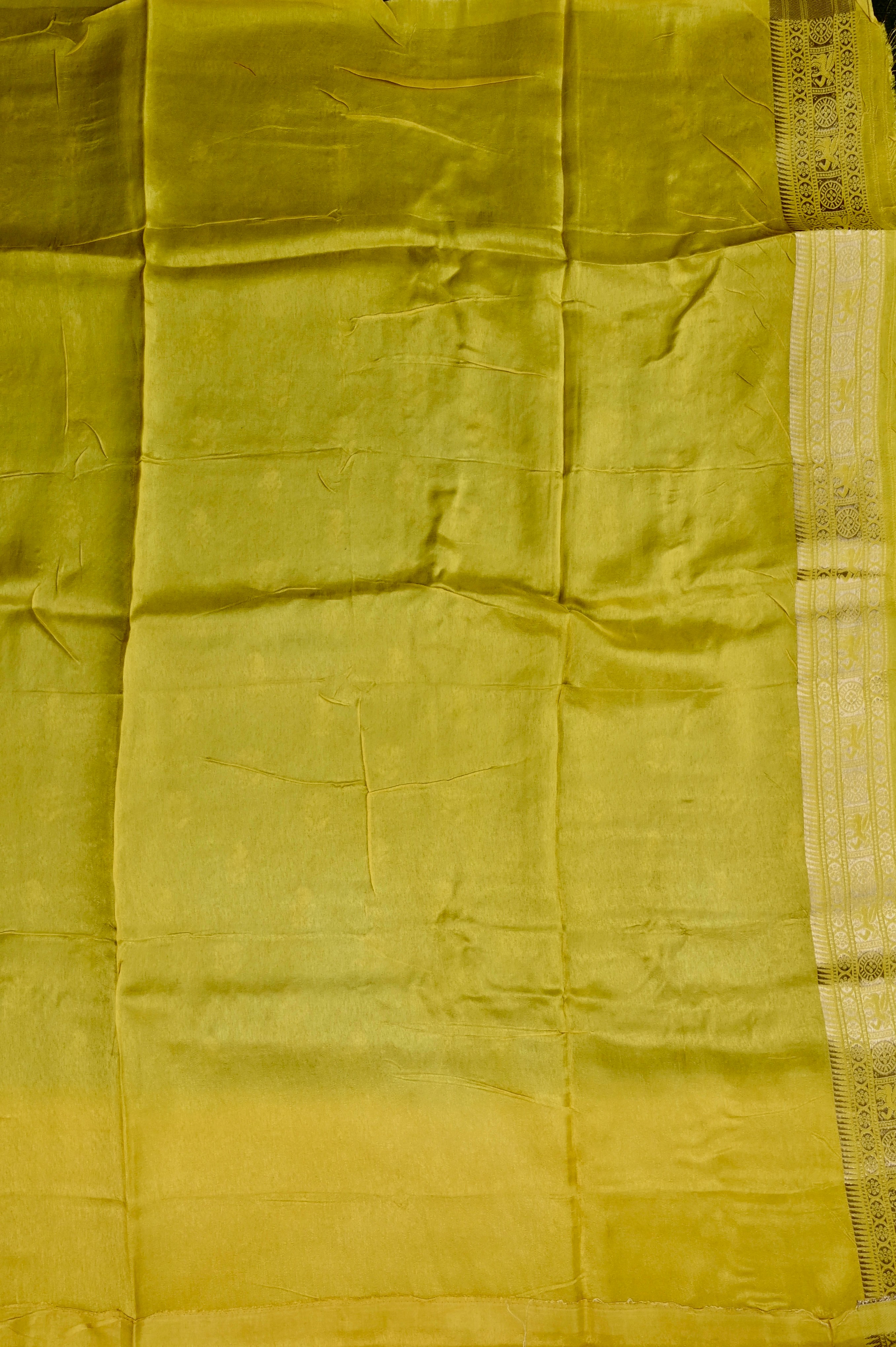 Dola silk saree green color with allover zari motive weaves, big zari wooven border, pallu and plain blouse