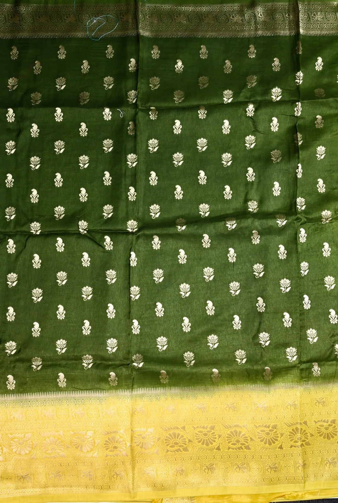 Dola silk saree green color with allover zari motive weaves, big zari wooven border, pallu and plain blouse