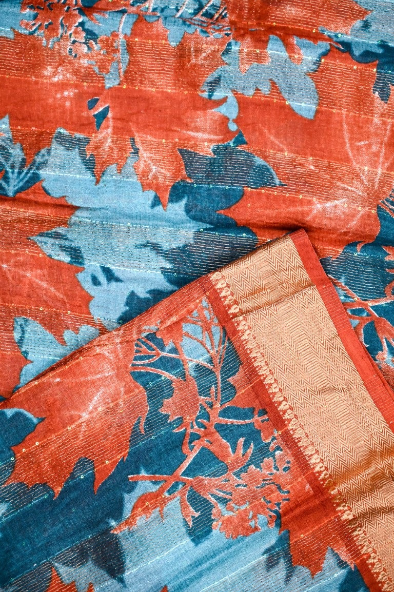 Jute fancy saree blue color with allover prints, short pallu, small gold zari kaddi border and blouse