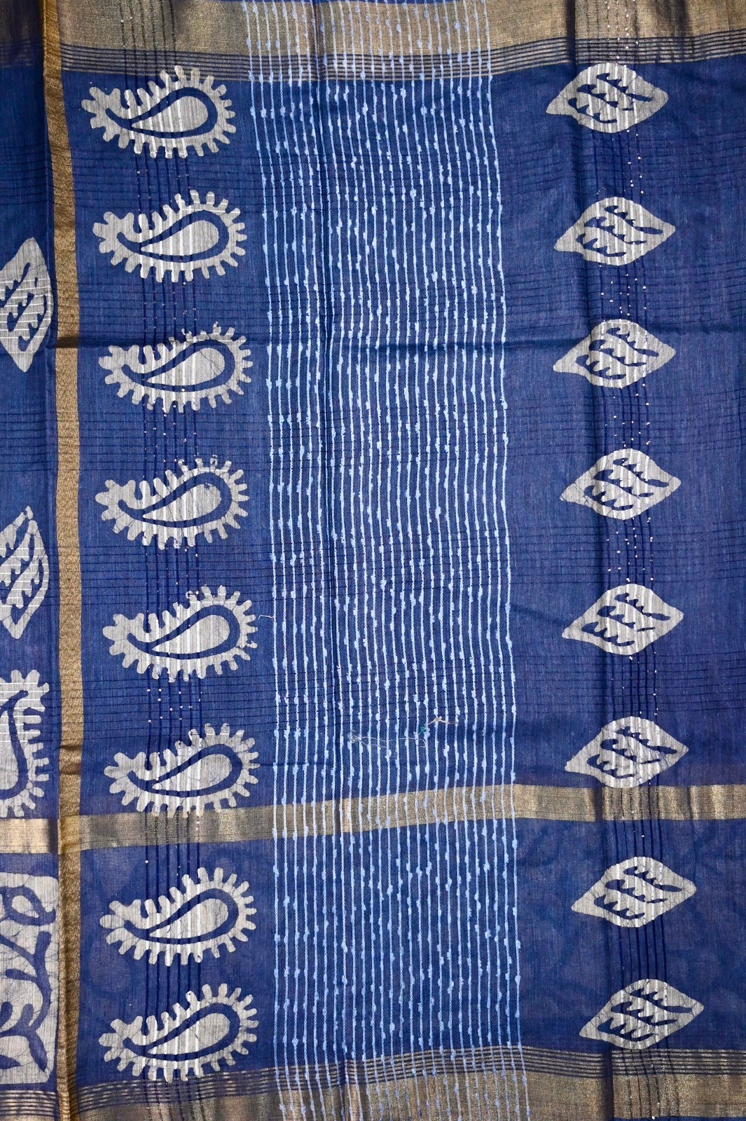 Jute tussar fancy saree brown color with allover batik prints, big border with zari, pallu and plain blouse