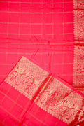 Dola silk saree pink color with allover zari checks, big zari border, short pallu and brocade blouse