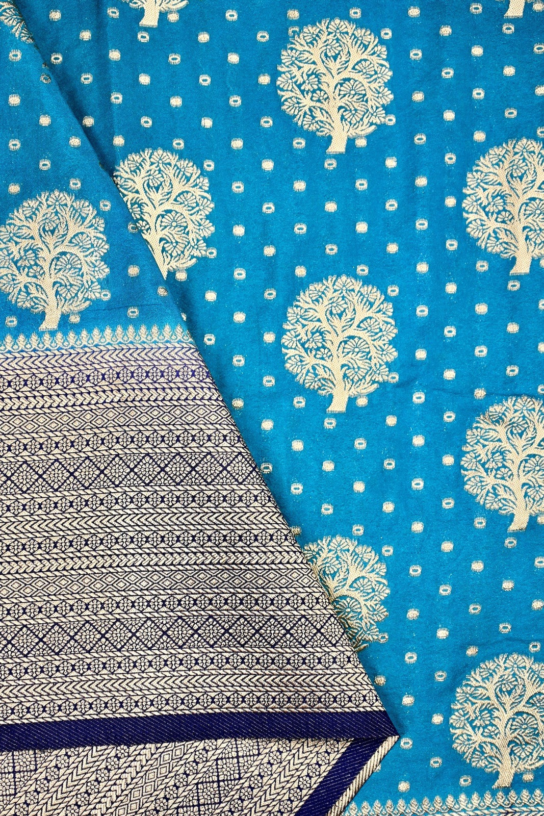 Banaras fancy saree rama green and blue color with allover zari motive weaves, big zari border, pallu and plain blouse.